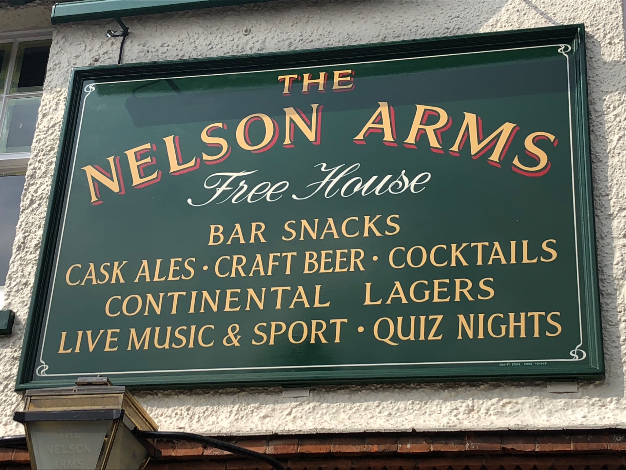 The Nelson Arms free house sign